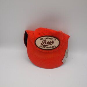The answer to life's problem:Beer cap with attached bottle opener
